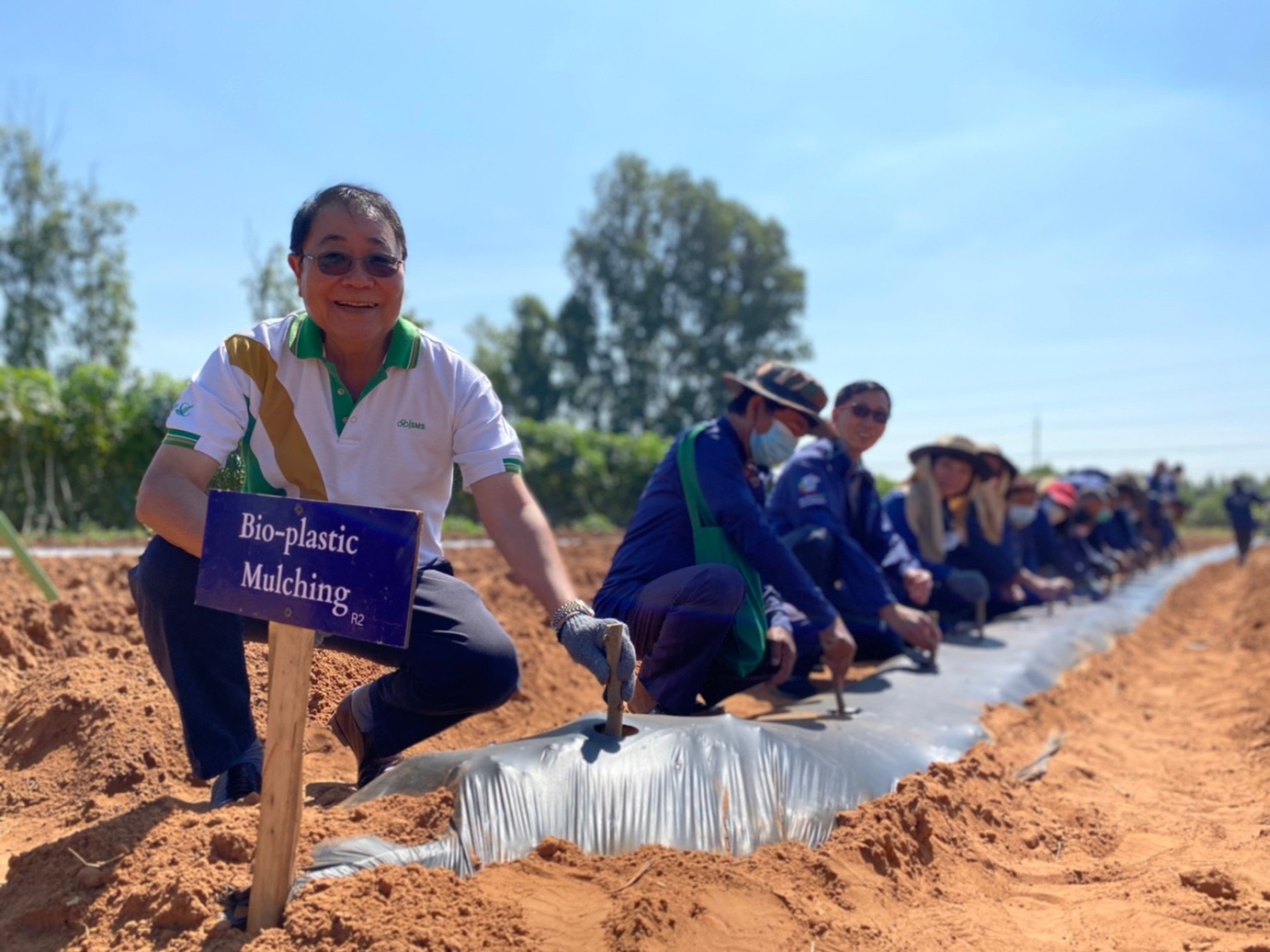 Leading the team to plant in biodegradable mulch film.jpg